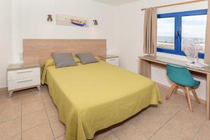 Postel nebo postele na pokoji v ubytování Hostal Magec