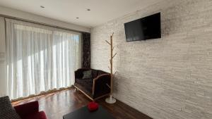 TV o dispositivi per l'intrattenimento presso Studio tout confort au calme avec jardin proche Cannes