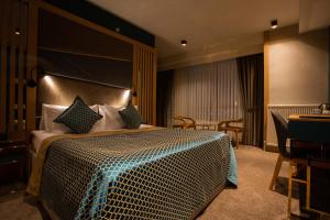 Ένα ή περισσότερα κρεβάτια σε δωμάτιο στο Joyana Otel