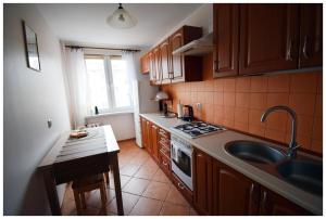 Η κουζίνα ή μικρή κουζίνα στο Color Apartment Ciepłe Gniazdko +15 φωτογραφίες
