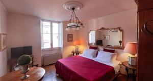 A bed or beds in a room at Corte Cristina & Suites