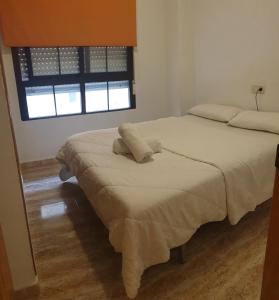 Posteľ alebo postele v izbe v ubytovaní Apartamento Guardamar Playa