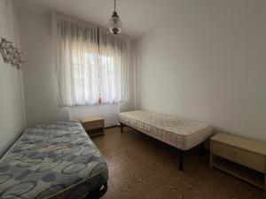 A bed or beds in a room at Altan