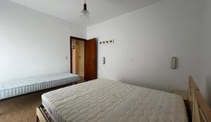 A bed or beds in a room at Altan