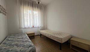 A bed or beds in a room at Altan
