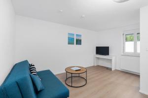 TV a/nebo společenská místnost v ubytování Apartment Bodensee 29 mit Küche und Garten