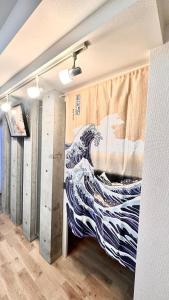 Postel nebo postele na pokoji v ubytování Heart of Otaru, Mountain and Otaru city view + 11 fotografií