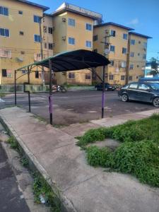 a bus stop with a black canopy on a street at Pousada Victor - Arte in Manaus