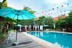 Bazén v ubytování Srey Krob Leak Resort , ស្រីគ្រប់លក្ខណ៌ រីសត nebo v jeho okolí