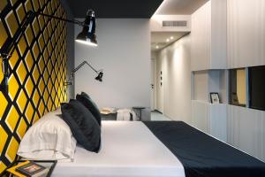 Postel nebo postele na pokoji v ubytování Catania Smart Hotel
