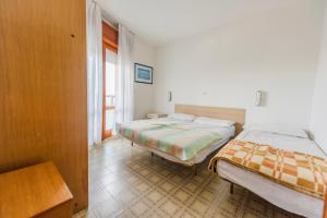 A bed or beds in a room at Altan