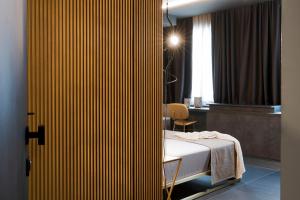 Postel nebo postele na pokoji v ubytování Catania Smart Hotel