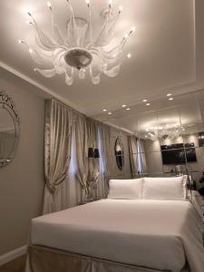 A bed or beds in a room at Cà Dell'Arte Palace