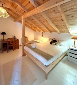 a large bed in a room with a wooden ceiling at Quinta Felicidade - Sea&Surf in Óbidos +58 photos