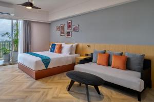 Postel nebo postele na pokoji v ubytování Birkin International Hotel