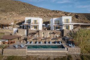 an external view of a villa with a swimming pool at Kastellas' Dream in Kithnos