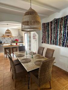 a dining room with a table and chairs at Villa Azafran in Málaga