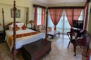 Postel nebo postele na pokoji v ubytování Beach Rock Resort Belitung