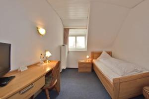 Letto o letti in una camera di Hotel Hirschen