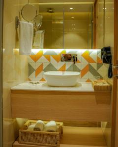 a bathroom with a sink and a mirror at Best Western AH1 Amritsar in Amritsar