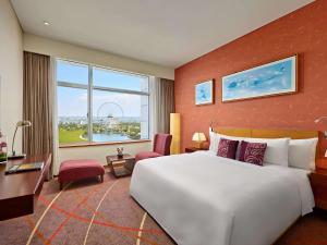 Postel nebo postele na pokoji v ubytování Grand Mercure Danang