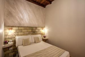 Colosseo Accomodation Room Guest House客房内的一张或多张床位