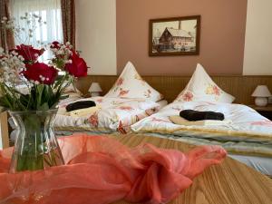 Postel nebo postele na pokoji v ubytování Hotel-Pension Flechsig