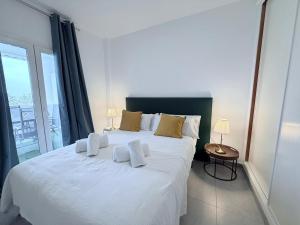 Llit o llits en una habitació de PLAYA ROCIO 62 2 PUERTO BANÚs