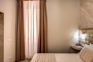 Colosseo Accomodation Room Guest House客房内的一张或多张床位