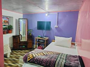 Postel nebo postele na pokoji v ubytování Lamahatta Rai Homestay