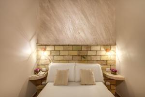 Colosseo Accomodation Room Guest House客房内的一张或多张床位