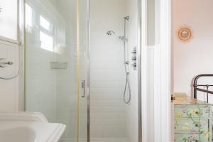 a bathroom with a shower and a sink at Seafarer by Keepers Cottages in Kingsdown +12 photos