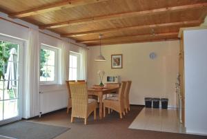 a dining room with a table and chairs at Fewo Stricker 31 in Walkenried
