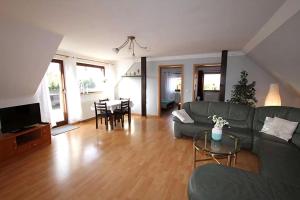 a living room with a couch and a table at Ferienwohnung Anna in Schwarz