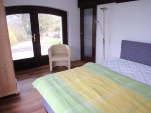 A bed or beds in a room at Haus Traunsee Blick