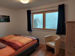 A bed or beds in a room at Haus Traunsee Blick