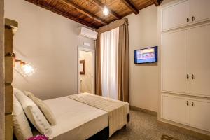 Colosseo Accomodation Room Guest House客房内的一张或多张床位
