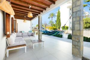 a living room with a hammock on a house at Villa Can Ordinas in Alcudia