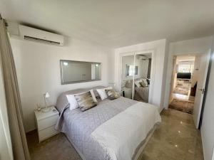 Ένα ή περισσότερα κρεβάτια σε δωμάτιο στο K13 Ocean Point - Apartment