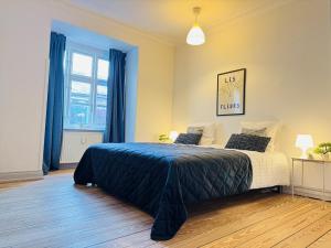 Postel nebo postele na pokoji v ubytování aday - Beautiful and Spacious 4 bedroom - Heart of Aalborg