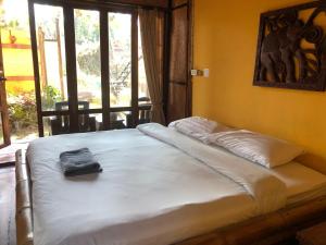 Postel nebo postele na pokoji v ubytování Pai resort pageryaw