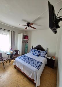 Postel nebo postele na pokoji v ubytování Hotel Catalina + 10 fotografií