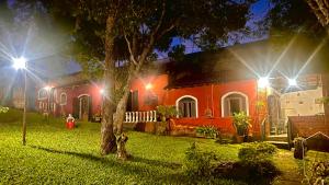a house with two street lights in front of it at Sítio pousada recanto curió in Ibiúna