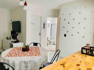 a room with a table with a white table cloth on it at Apartamento Studio 201 in Juazeiro