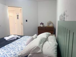 a bedroom with a bed with pillows on it at Apartamento Studio 201 in Juazeiro
