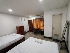 Ένα ή περισσότερα κρεβάτια σε δωμάτιο στο Lucena Apartments