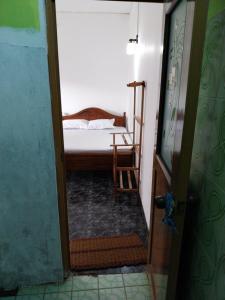 Ένα ή περισσότερα κρεβάτια σε δωμάτιο στο Inuli Coco Hut