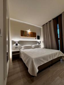 Postel nebo postele na pokoji v ubytování Confidence Hotel Parma