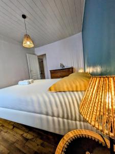 En eller flere senge i et værelse på Havre de paix