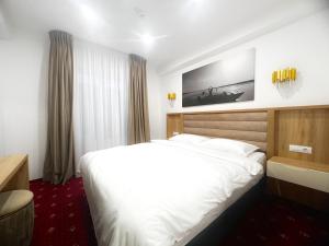 Postel nebo postele na pokoji v ubytování Mimi Hotel + 27 fotografií